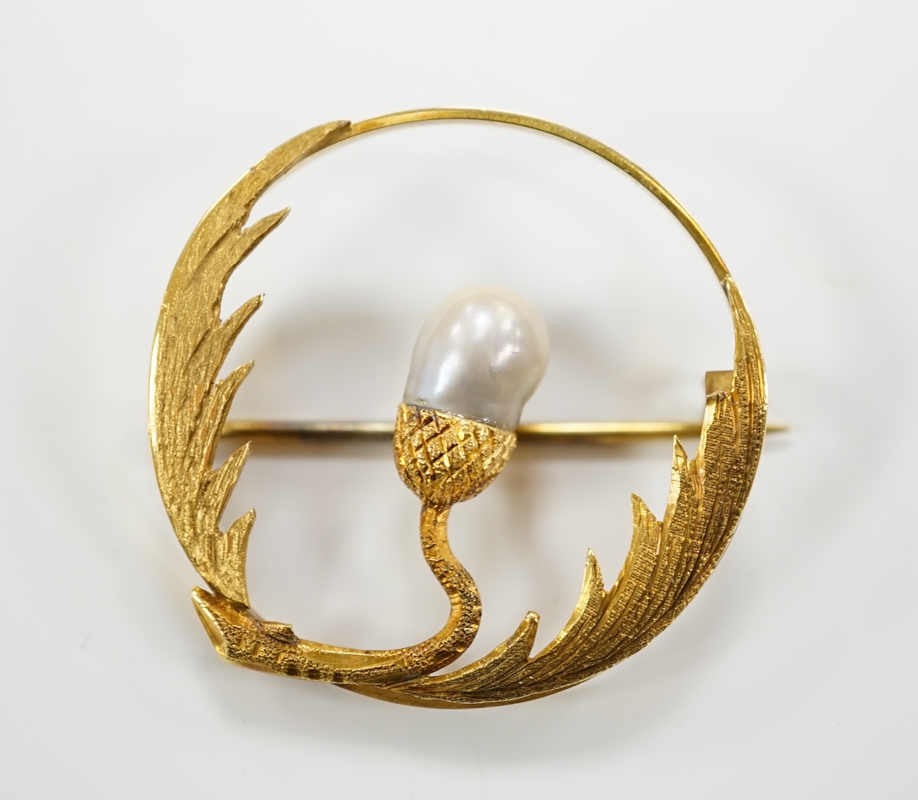 A late Victorian 15ct and baroque pearl set open work thistle brooch, 34mm, gross weight 6.1 grams.